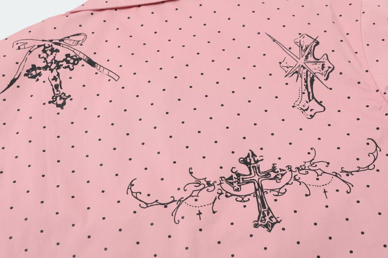 Close-up of pink shirt back with black cross and chain graphics