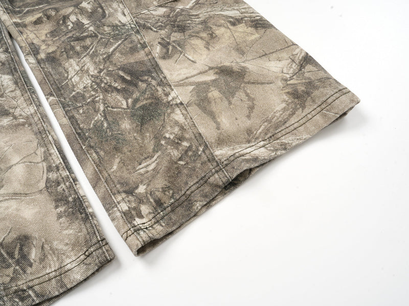 Close-up of lower leg and cuff hem on forest camo wide-leg pants
