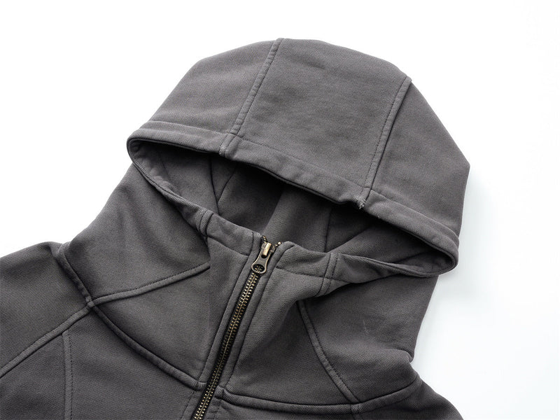 Close-up of gray hoodie hood and top front zipper on white background
