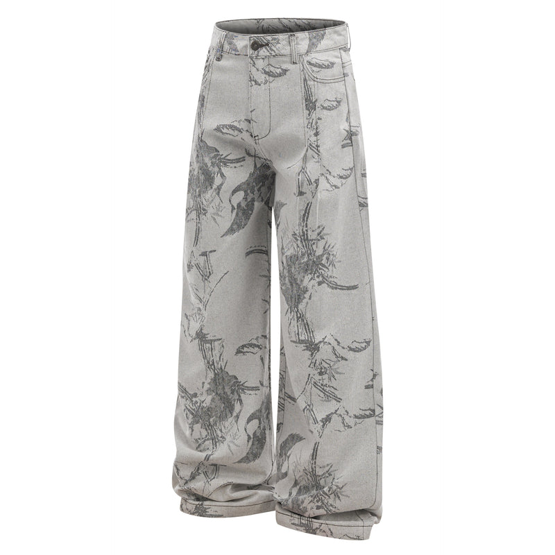 Three-quarter front view of gray wide-leg denim pants with abstract brushstroke print