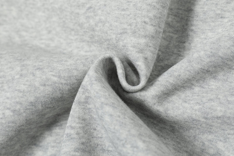 Light gray hoodie fabric close-up with soft knit folds