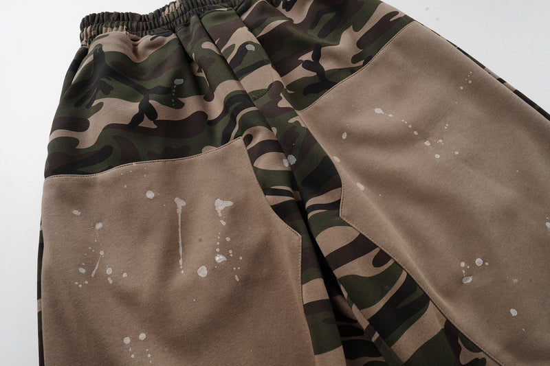 Close-up of tan front panel and camo side panel with white paint splatter