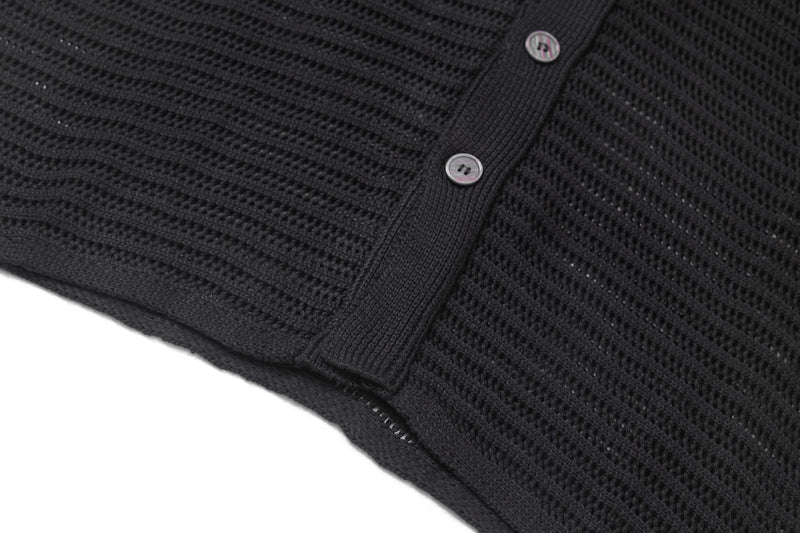 Black open-knit short-sleeve button-up shirt with textured star pattern and two-button front placket