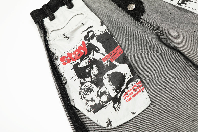 Close-up of graphic front pocket with skull print and red 'stay' text on white denim panel