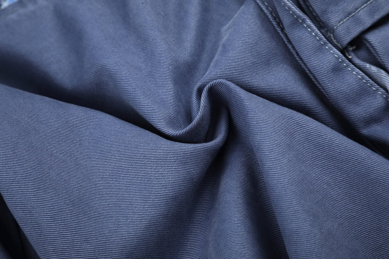 Close-up of blue cargo shorts fabric drape and seam texture