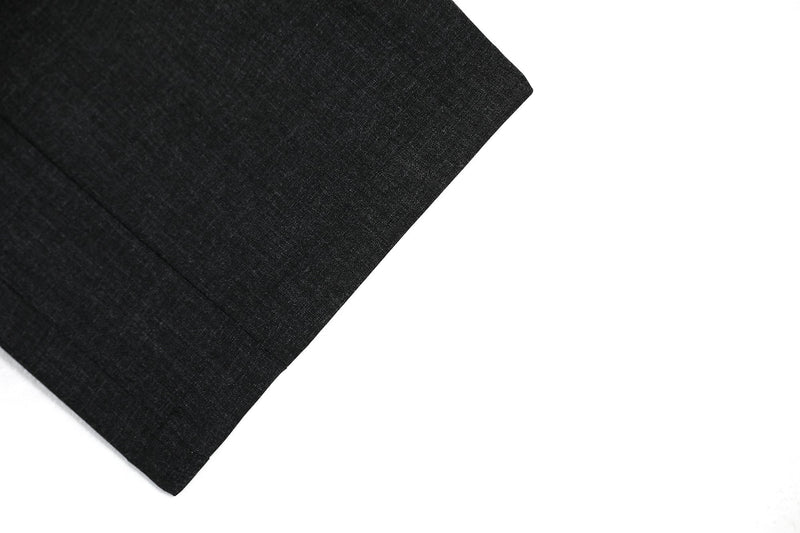 Close-up of black pants leg hem with clean finished edge