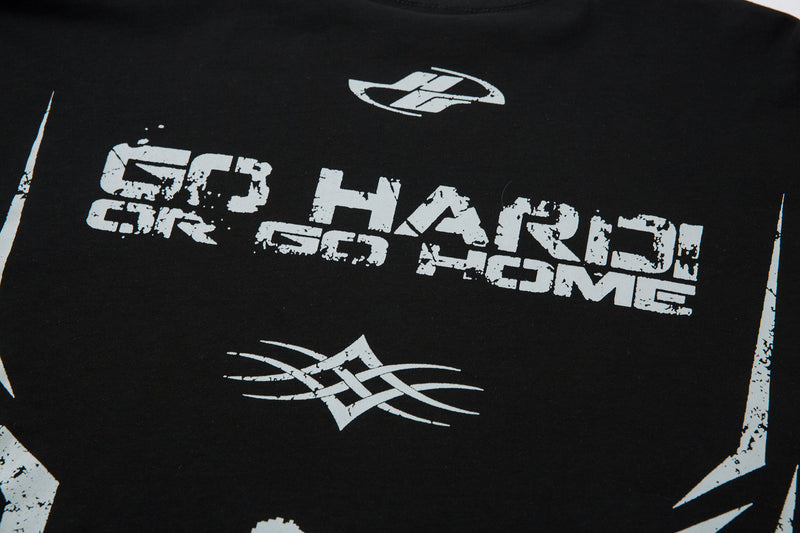 Close-up of black tee upper front with distressed Go Hard Or Go Home print and white stripe graphic