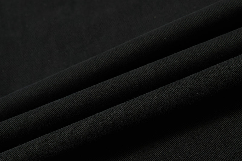 Close-up of black cotton twill fabric with fine diagonal ribbed texture