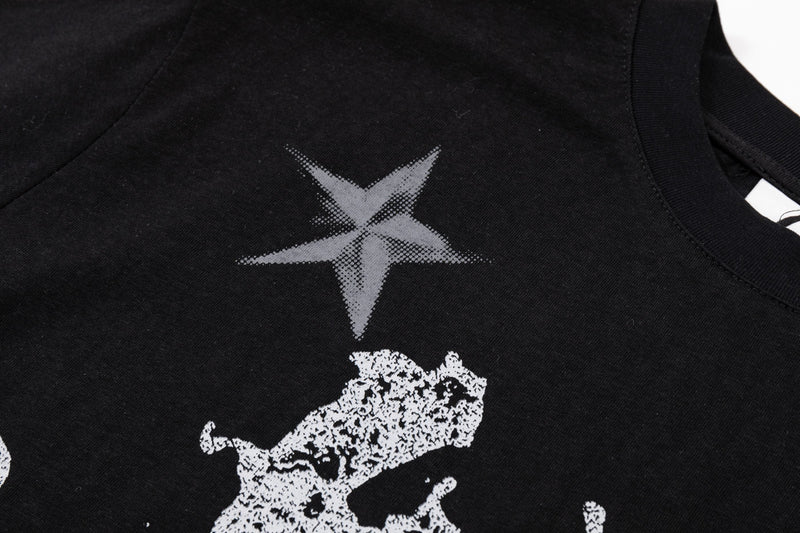 Black oversized graphic tee with white gothic star and lion print on the chest, Y2K streetwear style