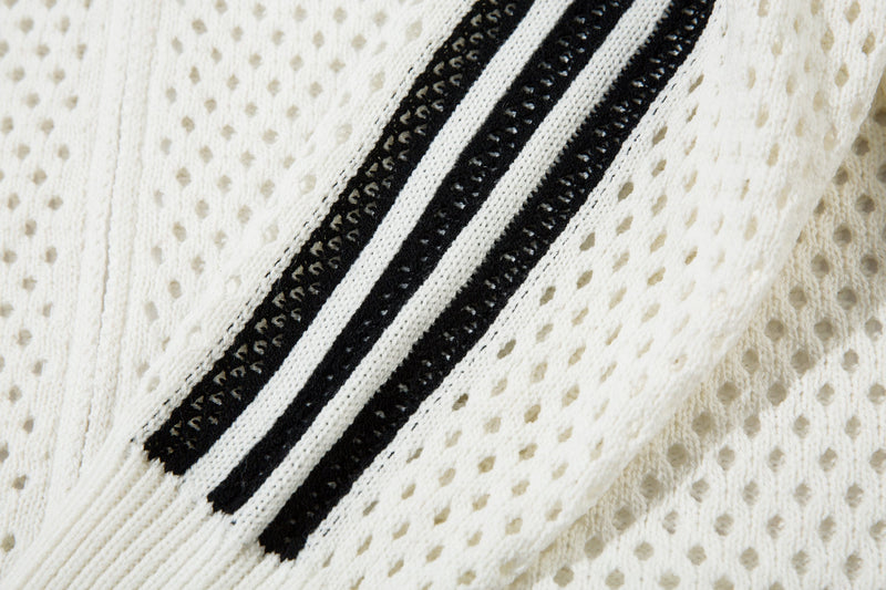 Close-up of white sleeve stripe in black and white mesh knit