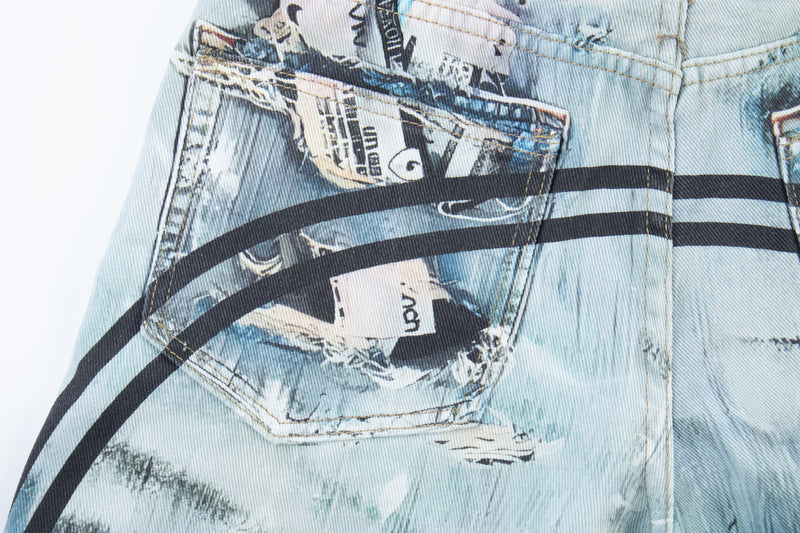 Close-up of back pocket with graphic print and black curved stripe on denim