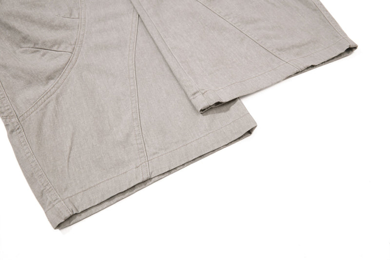 Beige cargo pant hem detail with stitched panel seams