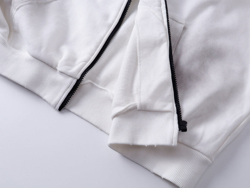 Close-up of white zip hoodie hem and front zipper with ribbed cuffs and soft sweatshirt fabric
