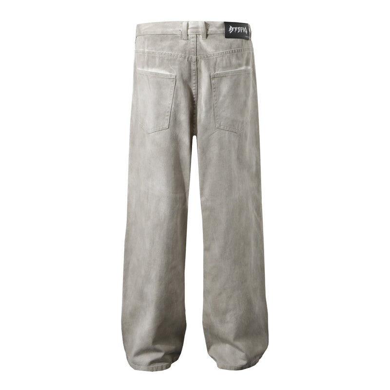 Back view of washed beige wide-leg cargo pants with rear patch pockets