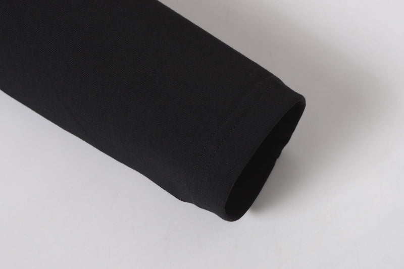 Close-up of black long sleeve cuff with smooth knit texture