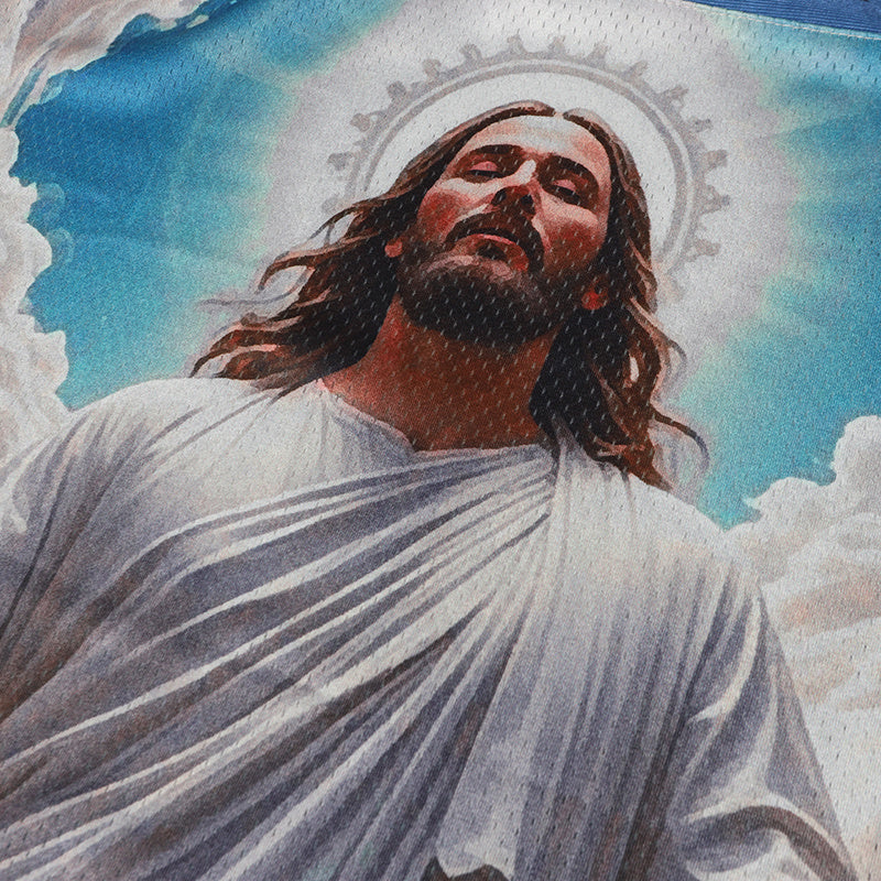 Blue football jersey featuring a sacred Jesus graphic with halo, flowing hair, and cloudy sky background