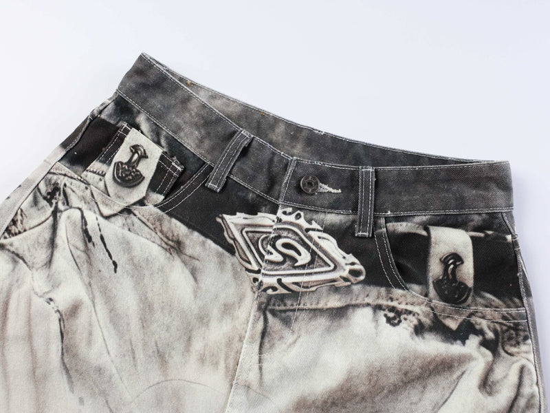 Angled front waist view showing abstract wash print, belt loops, and pocket details