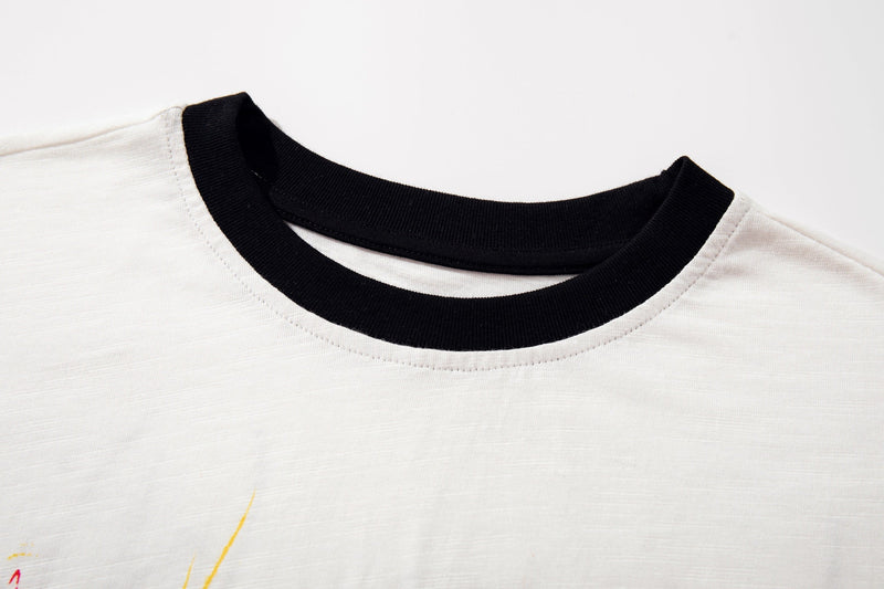 White Number (N)ine graphic T-shirt with black ribbed crew neck and yellow horse print detail