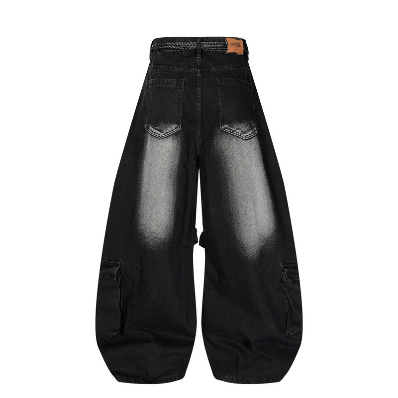 Back view of black wide leg jeans with two back pockets and brown patch label