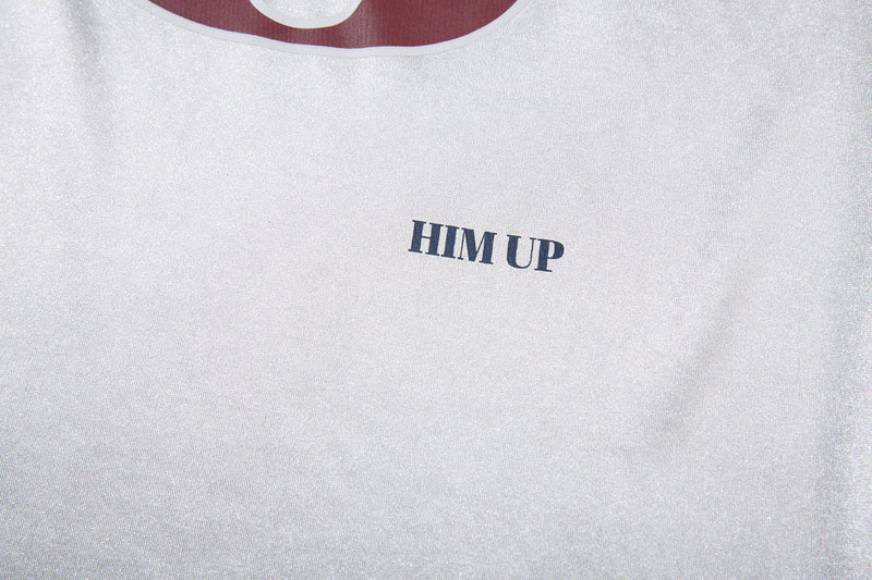 Close-up of white jersey tee chest with HIM UP text