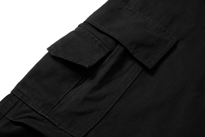 Close-up of cargo pocket flap on black pants