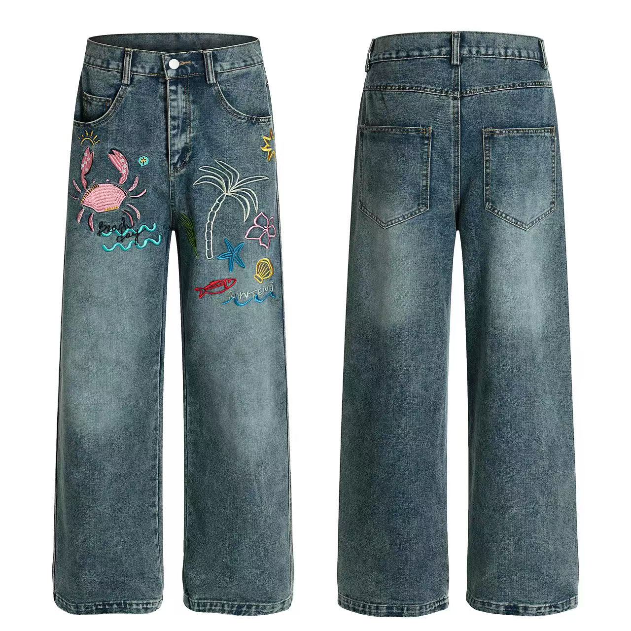Front and back view of wide-leg blue denim jeans with colorful tropical embroidery including a crab, palm tree, starfish and