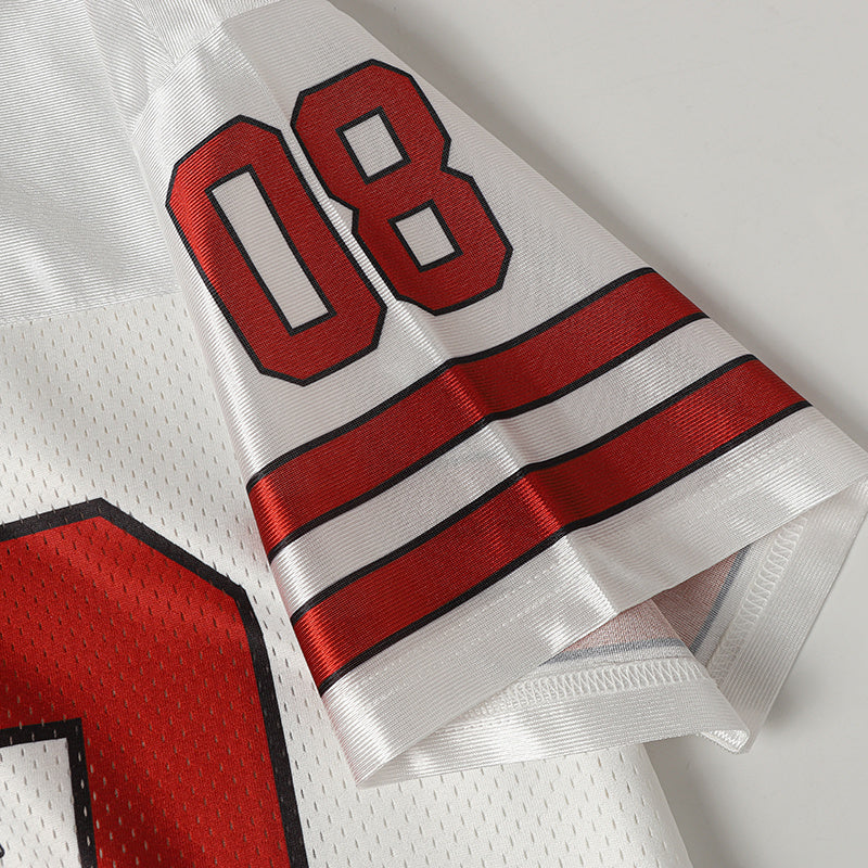 White football jersey sleeve with red number 08 and striped trim, featuring a Donald Duck streetwear graphic design