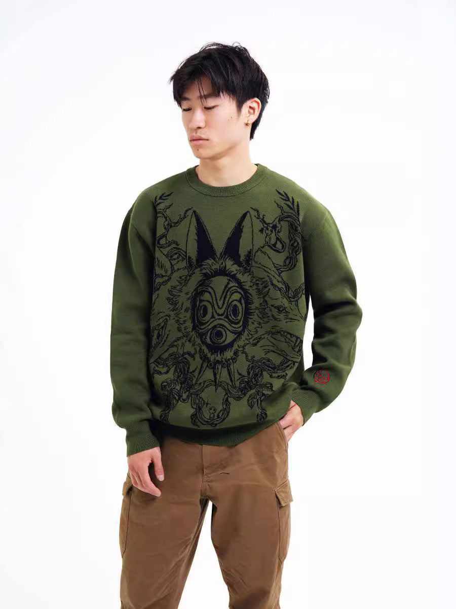 A person stands with their eyes closed, wearing Seakoff's beige Princess Mononoke inspired sweatshirt featuring a wolf spirit mask and red claw design, along with brown pants. The plain white background complements the anime streetwear vibe.
