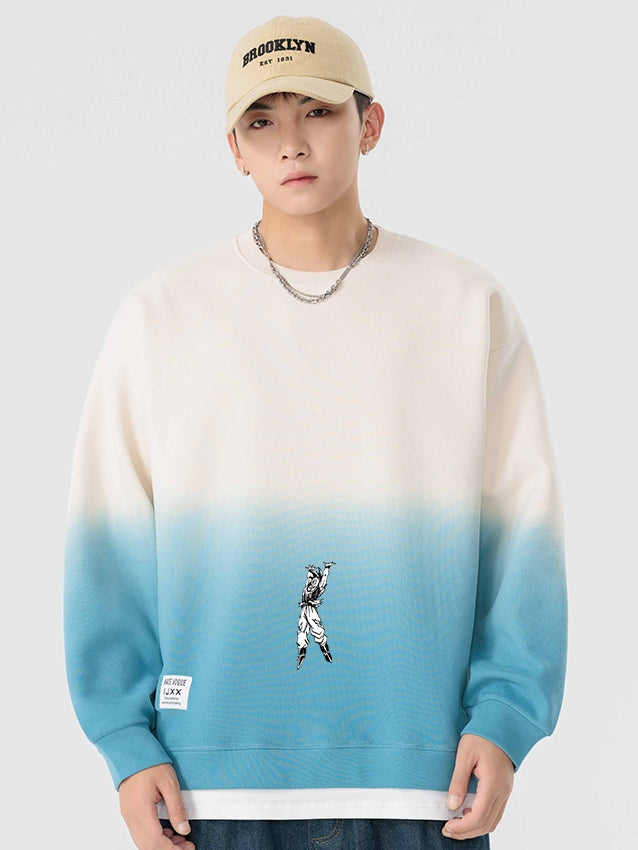 A person is wearing a SEAKOFF Limited Edition Dragon Ball Sweatshirt with a Goku Spirit Bomb Gradient Design in beige and blue. They pair it with a beige &quot;BROOKLYN&quot; cap and a chain necklace, all against a simple white backdrop.