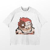 The Retro Sukuna Parody T-Shirt by Jujutsu Kaisen is a light gray oversized tee featuring a retro-inspired graphic of Sukuna with red spiky hair and mixed expression, offering an anime streetwear vibe against a plain background.