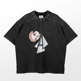 The Retro Jujutsu Kaisen Parody T-Shirt features a Sukuna hanging doll design with red hair and white eyes, accented by triangular elements. In classic black with speckles, it includes short sleeves and a ribbed collar for comfort. This oversized tee offers both style and fun.