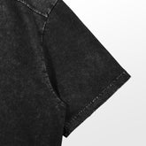 Close-up of the Jujutsu Kaisen Toji Fushiguro Vintage Oversized T-Shirt sleeve in Distressed Black, showcasing anime streetwear style. Perfect textured fabric for any fan embracing the Jujutsu Kaisen vibe against a neutral background.