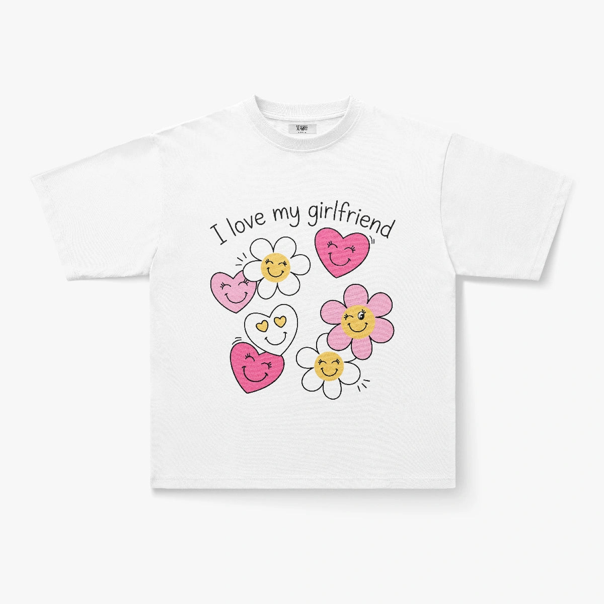 The I Love My Girlfriend Smiley Heart Daisy Graphic Print T-Shirt features the text above cheerful cartoon flowers and hearts in pink, yellow, and white—a cute Y2K-style tee for a playful vibe.