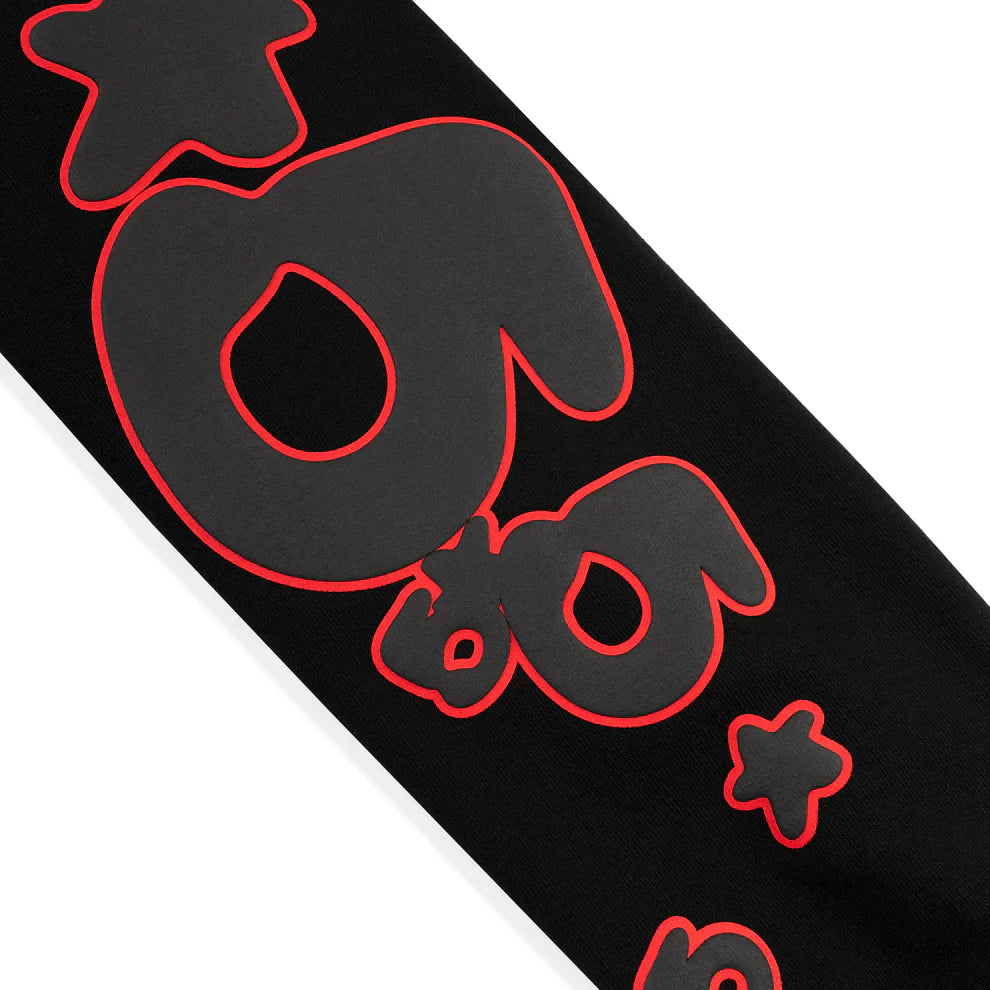 The Sp5der 440GSM Heavyweight Star Hoodie – Black & Grey Oversized Streetwear Pullover features bold, abstract shapes outlined in red with stars and rounded forms, adding a streetwear edge to your style.