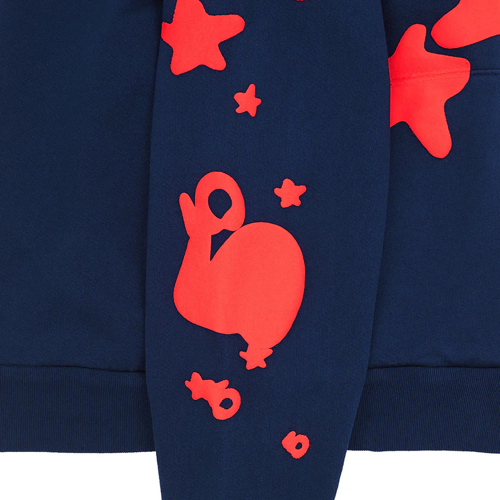 The Sp5der 440GSM Heavyweight Hoodie is a navy blue streetwear pullover featuring bold red star puff prints on cozy cotton fleece, offering standout Y2K-inspired style.