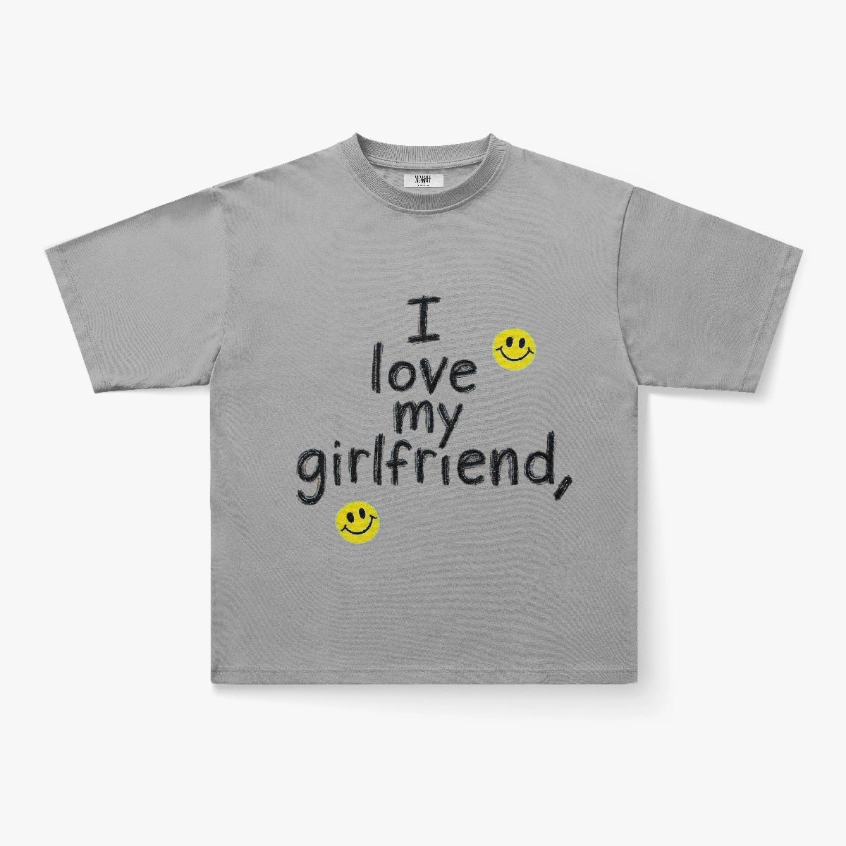 The I Love My Girlfriend Handwritten Graphic Oversized T-Shirt features a gray boxy fit with black text, “I love my girlfriend,” plus two yellow smiley faces for a playful Y2K streetwear vibe.