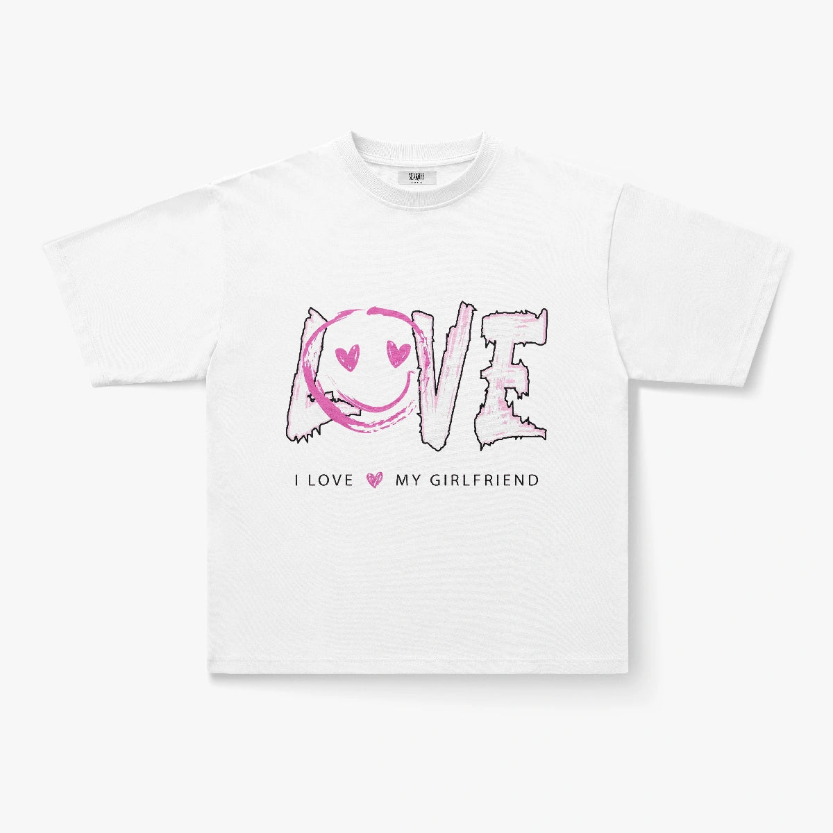 The I Love My Girlfriend Pink Smiley Graphic Oversized White T-Shirt features "LOVE" with a heart-eyes smiley O and pink hearts, plus "I LOVE MY GIRLFRIEND" below—perfect for couples or as a trendy Y2K-inspired tee.