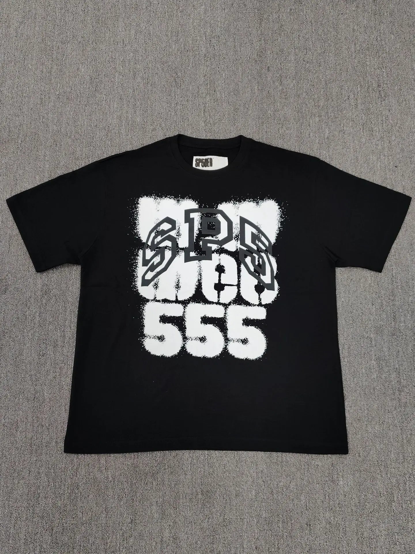 Black Sp5der 555 graphic short sleeve t-shirt with bold white spray-paint style lettering on the front