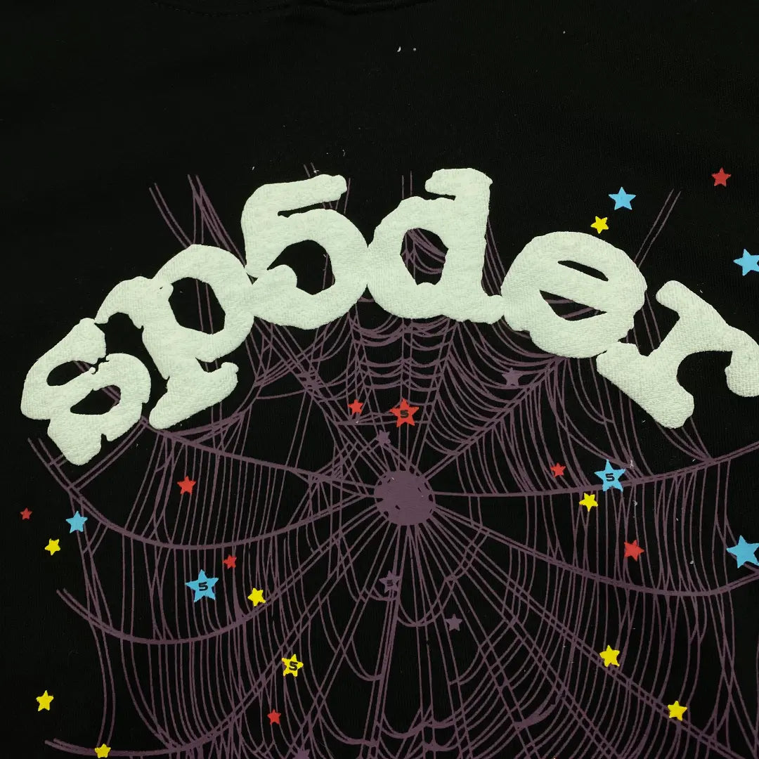 The image features "sp5der" in white text above a purple web with colorful stars on black—ideal for the Black Sp5der Web Hoodie 440GSM, a core black spider hoodie with a purple web and white stars.