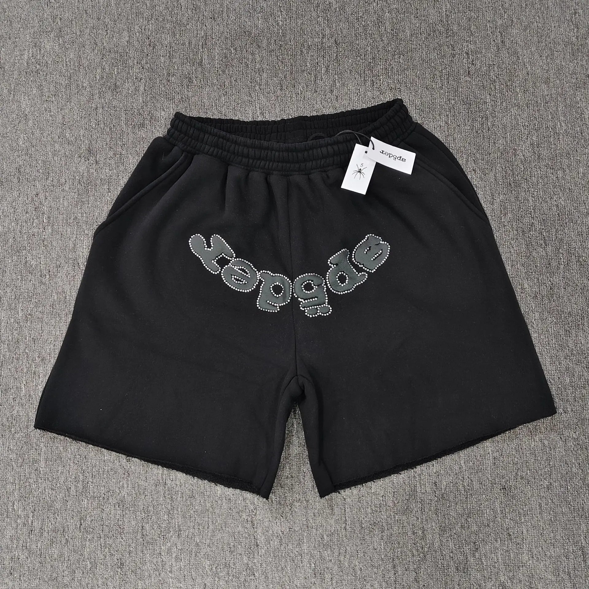Sp5der black cotton jogger shorts with front rhinestone letter graphic and elastic drawstring waistband