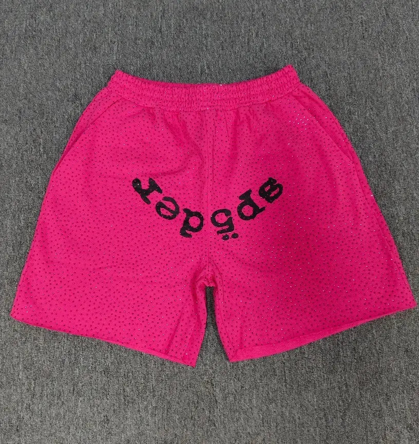 Pink Sp5der jogger shorts with black front logo print and scattered rhinestones