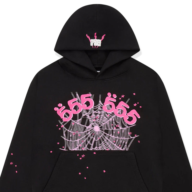 The Sp5der 555 Hoodie – Black & Pink Web 440GSM Heavyweight Streetwear Pullover features Y2K-inspired graphics: a white hand, pink arms, pink "555" and "Ü" on the chest, plus a white spider web and small pink stars for luxury streetwear fans.