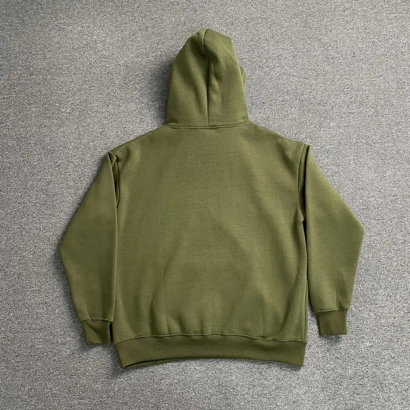 The Syna World Green Letter Print Pullover Hoodie is displayed flat on a gray surface, back view shown with sleeves and hood—an ideal classic pullover for streetwear lovers.