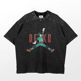 This oversized washed black My Hero Academia T-shirt features a vintage design with DEKU in a dynamic jumping pose, wearing red shoes and green attire, against bold red "DEKU" lettering. The slightly faded look makes it perfect for anime fans seeking casual style.